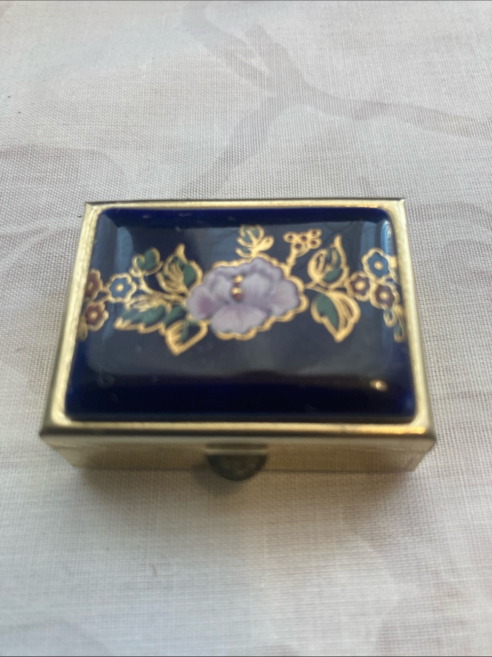 Navy floral metal pill box